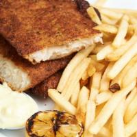 Fish And Chips · Hand-battered fried white fish served with tartar sauce & fresh lemon wedges