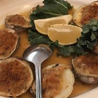 Clams Oreganate · Baked clams with seasoned breadcrumbs in white wine and lemon sauce.