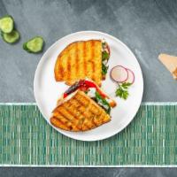 Veggie Delight Panini · Fresh mozzarella cheese with plum, tomatoes, and spinach sun-dried tomato spread on toasted ...