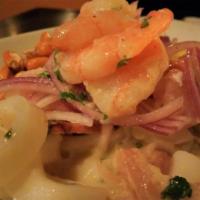 Ceviche Mixto · Catch of the day , jumbo shrimp, calamari rings, and sliced octopus marinated in lime juice ...
