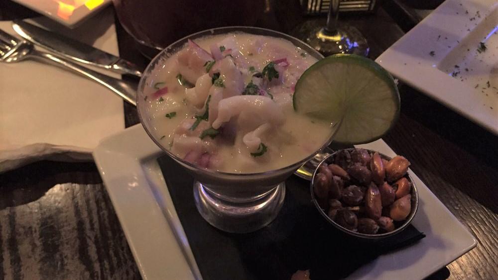Leche De Tigre · A mini fish and calamari ceviche style concentrate. The best of a ceviche served in a martini glass