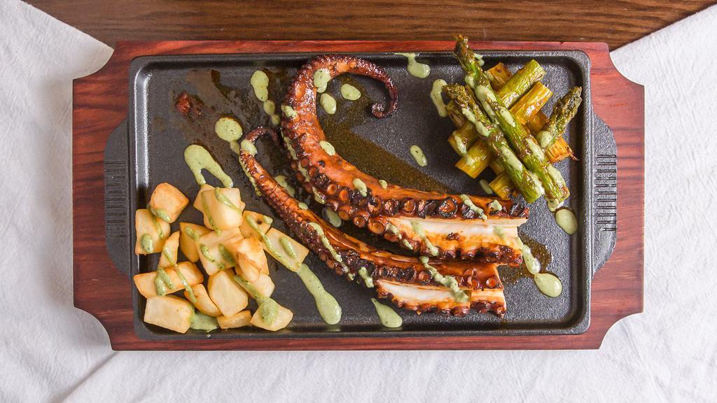 El Pulpito · Spanish pulpo grilled to perfection served with  roasted potato and grilled asparagus