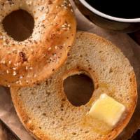 Buttered Bagel · Plain bagel buttered and toasted golden-brown.