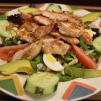 Cobb Salad · Grilled chicken breast, avocado, blue cheese, bacon, hard boiled egg, cucumber & tomato, ove...