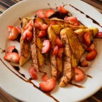 Mrs R'S French Toast · Filled with mascarpone, topped with chocolate syrup & strawberries.