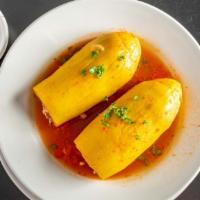 Stuffed Squash · Favorite. Summer squash stuffed with lamb and rice served in a tomato broth. Served with hom...