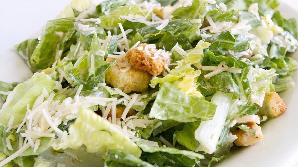 Classic Caesar Salad · Romaine lettuce, garlic croutons, Parmesan cheese, grape tomatoes, and creamy Caesar dressing.