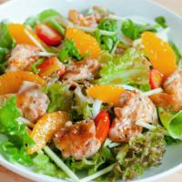 Asian Chop Salad · Spinach, romaine lettuce, oranges, green peas, carrots, red onions, grilled tofu, and Chines...
