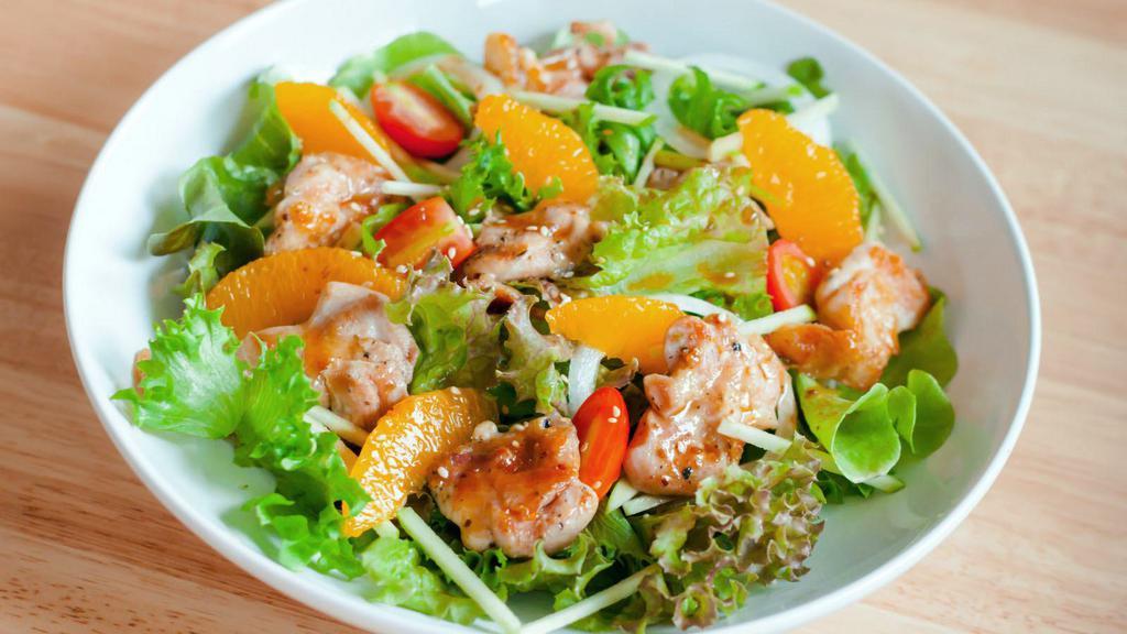 Asian Chop Salad · Spinach, romaine lettuce, oranges, green peas, carrots, red onions, grilled tofu, and Chinese noodles mixed with Asian sesame ginger dressing.