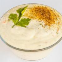 Cucumber Raita (8 Oz) · Vegan, gluten free. Homemade whipped yogurt with grated cucumber, cumin seeds and cilantro.