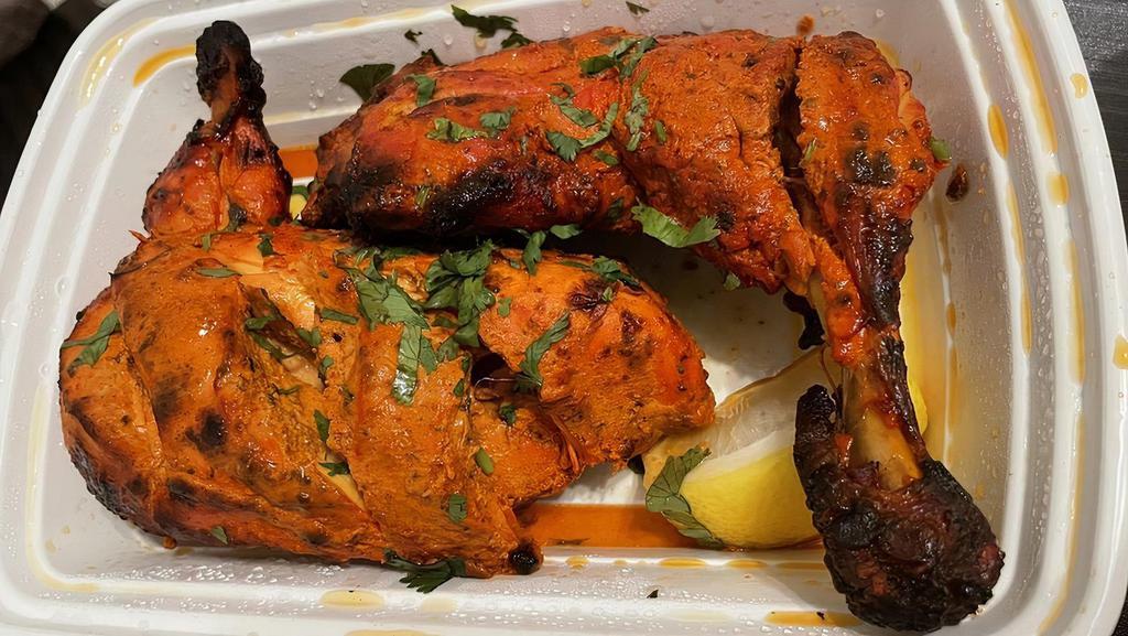Tandoori Chicken · Gluten free. An all - time favorite preparation; chicken on the bone in a marinade of ginger and garlic paste, strained yogurt, kashmiri red chillies ( mostly used for the crimson red color) and tellicherry peppercorns.