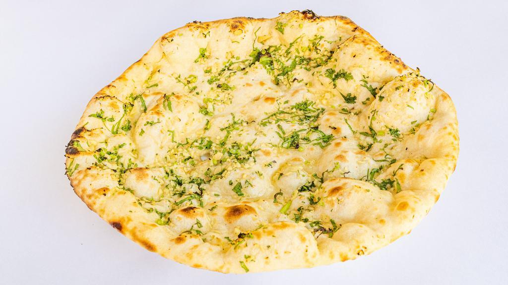 Garlic Naan · Leavened flour bread with fresh garlic.