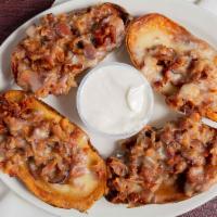 Loaded Potato Skins · Cheddar Cheese, Crisp Bacon and Sour Cream