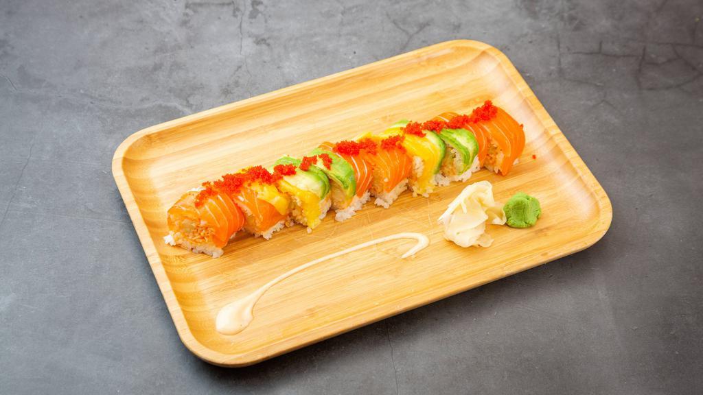 Beauty Roll · Spicy kani, cucumber inside, soybean wrapped, topped with salmon, mango and avocado with a sprinkle of caviar.