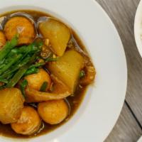 Curry Fishballs, Pork Skin, Leeks & Turnip (Daikon) · Fishballs, pork skin, leeks, and turnips covered in Hong Kong curry.  Plates come with seaso...