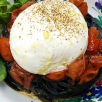 Squid Ink Linguine With Burrata · With anchovies, caramelized cherry tomatoes and Burrata