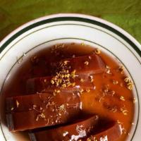 Sweet Lotus Root · Lotus Root Boiled with Red Bean and Osmanthus Flowers and Stuffed With Sticky Rice. Drizzled...