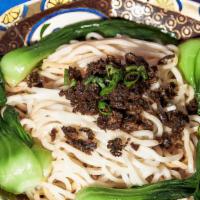 Dan Dan Noodle · Wheat Noodles Topped With Minced Pork, Pickled Vegetables, and Bok Choy in a Spicy, Tongue-T...