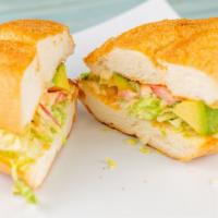 Cubana Sandwich · Pastor, beef cutlet, ham, mayonnaise, tomatoes, avocado, and white Mexican cheese.