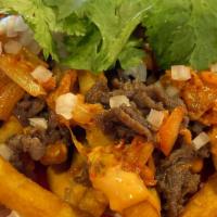 Kimchi Bulgogi Fries · Pan stirred kimchi, bulgogi and french fries topped with chopped onion, cilantro and spicy M...