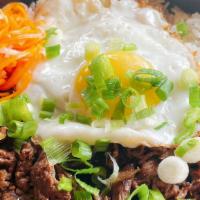 Bulgogi · Soy sauce marinated ribeye over white rice. Served with fried egg and pickled vegetable
