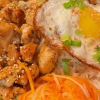 Chicken · Soy sauce marinated chicken over white rice. Served with fried egg and pickled vegetable.