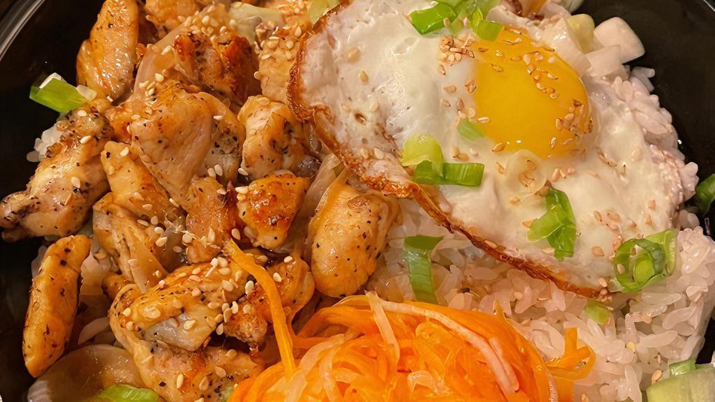 Chicken · Soy sauce marinated chicken over white rice. Served with fried egg and pickled vegetable.