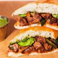 Carne Asada · chile-rubbed steak, avocado, poblano rajas, chimichurri