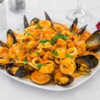 Zuppa Di Pesci · Mussels, calms, calamari, and shrimp in white or red sauce.