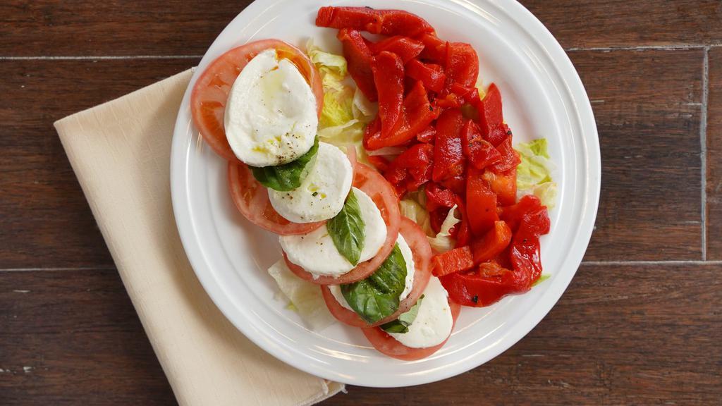 Tri Color Salad · Fresh mozzarella, tomatoes, basil and roasted peppers.
