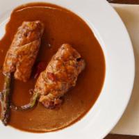 Chicken Rollatini · Chicken stuffed with roasted peppers, asparagus and provolone in a red wine sauce.
