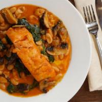 Salmon Campagnolo · Salmon with mushrooms and cannellini beans over spinach.