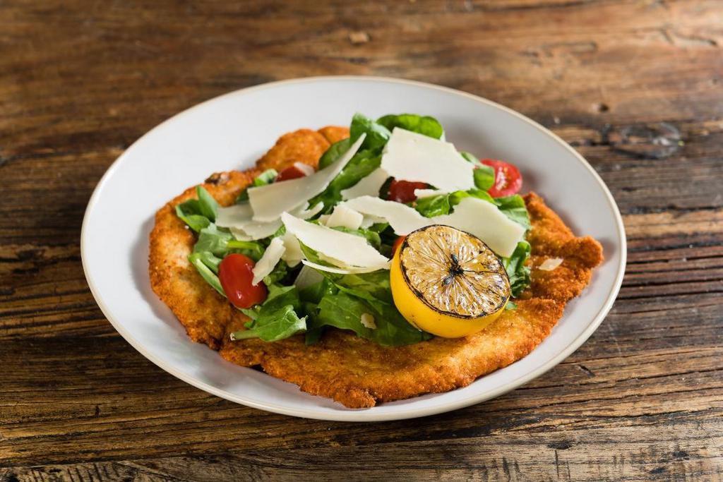 Milanese Di Pollo · traditional chicken Milanese, wild arugula, cherry tomatoes, shaved Parmigiano, balsamic reduction