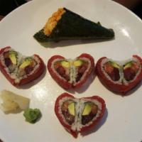 Valentine Roll · Tuna, salmon, yellowtail and avocado, topped w. tuna.