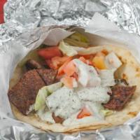 Lamb Gyro Combo · 100% natural lamb topped with fresh cut tomatoes, onions, and less. With tzatziki sauce. Ser...
