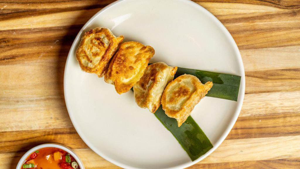 Pork & Chive Dumplings · Served with our House Soy Sauce.