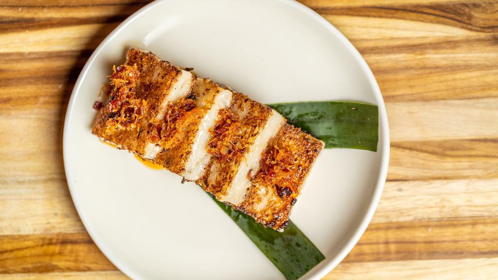 Crispy X.O Turnip Cake · Topped off with our House X.O Sauce *Contains Shellfish*