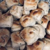 Garlic Knots · Rolled baked garlic bread.