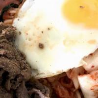 Bi Bim Bap · Beef with assorted vegetables served over rice and topped with an over easy egg. (Note: this...