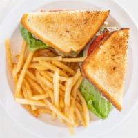Herbed Chicken Club · spiced grilled chicken, chipotle mayo, lettuce, tomato bacon on club white toast.