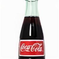 Mexican Coke · 12 oz bottle, Carbonated water, real sugar cane, caramel color, natural flavors, caffeine.