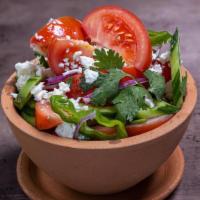 Traditional Salad · House salad with lettuce, tomatoes, cucumbers, sunflower oil, vinegar and onions. option of ...