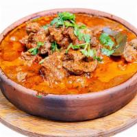 Ostri · Diced Beef stew simmered with tomatoes, seasoned with onion and herbs
