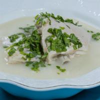 Chihirtma · Traditional Georgian chicken soup enriched with flower, topped with parsley and touch of gra...