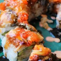 Black Dragon Roll · Shrimp tempura, avocado topped with eel, and special sauce.