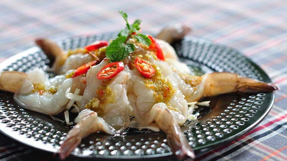 Goong Chae Nam Pla · Thai prawn sashimi with house special green chili sauce.