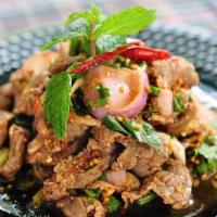 Nam Tok Nue · Grilled beef spicy salad mixed with roasted minced rice.
