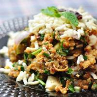Larb Pla Dook Yang · Spicy minced grilled catfish salad.