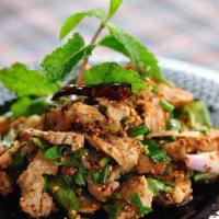 Nam Tok Moo · Grilled pork spicy salad mixed with roasted minced rice.