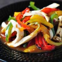 Yum Hed Yang Prik Whan · Grilled eringii mushrooms and bell peppers in light spicy sauce.